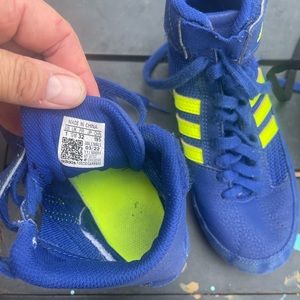 My son’s wrestling shoes. Worn for half of a season.